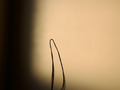 Close up of crochet hair structure against a neutral background