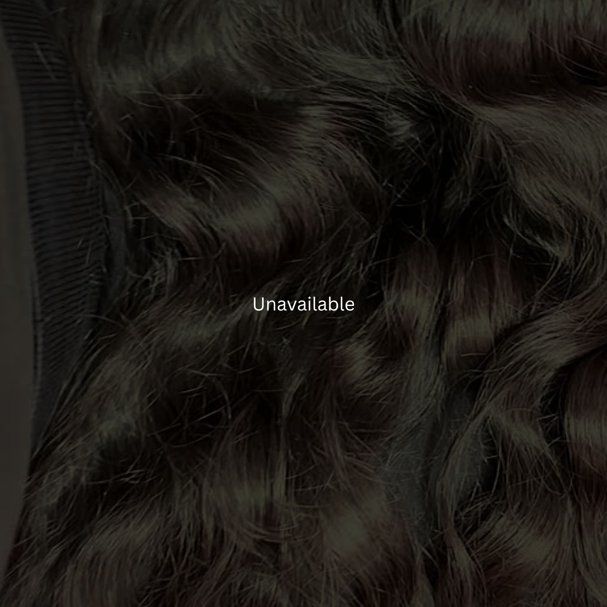 Close-up of black curly hair extensions with 'Unavailable' text overlay