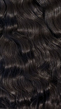 Close-up of natural black hair with wavy texture
