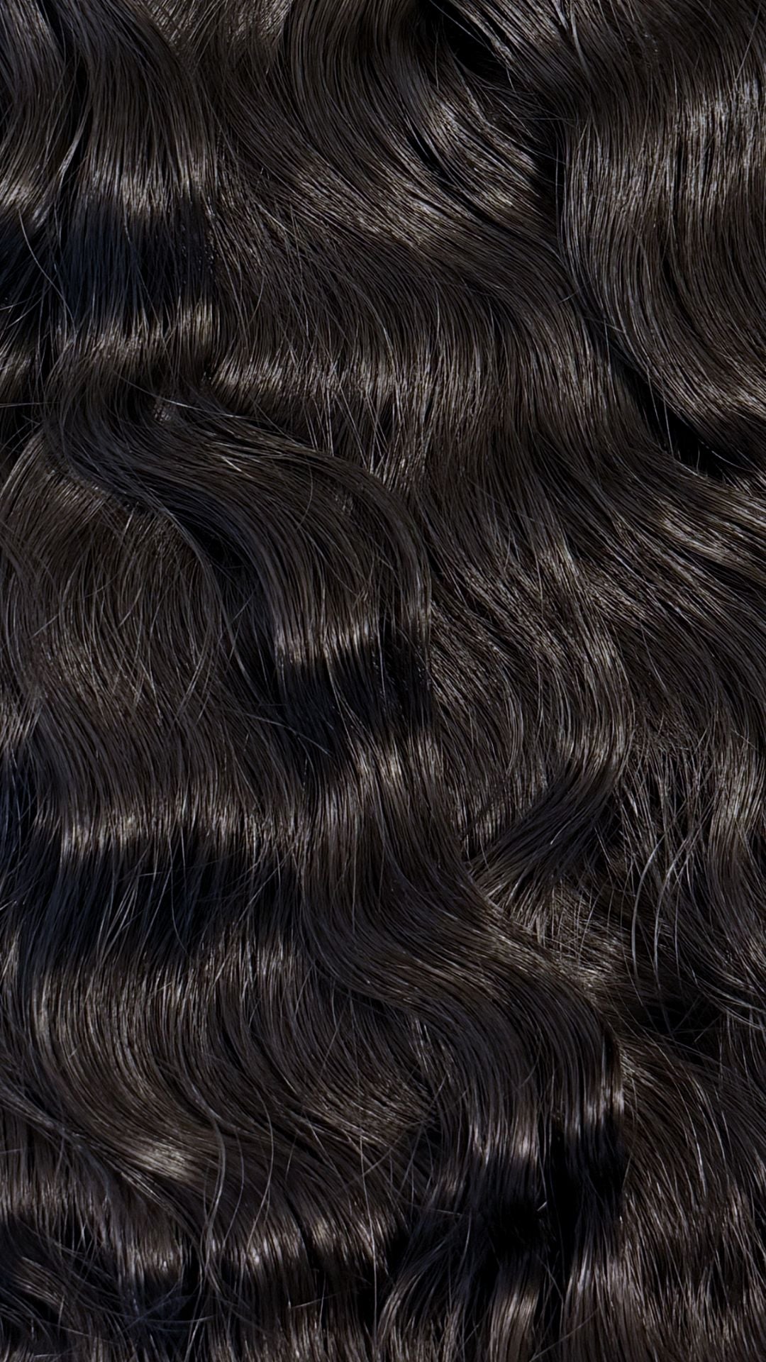 Close-up of natural black hair with wavy texture